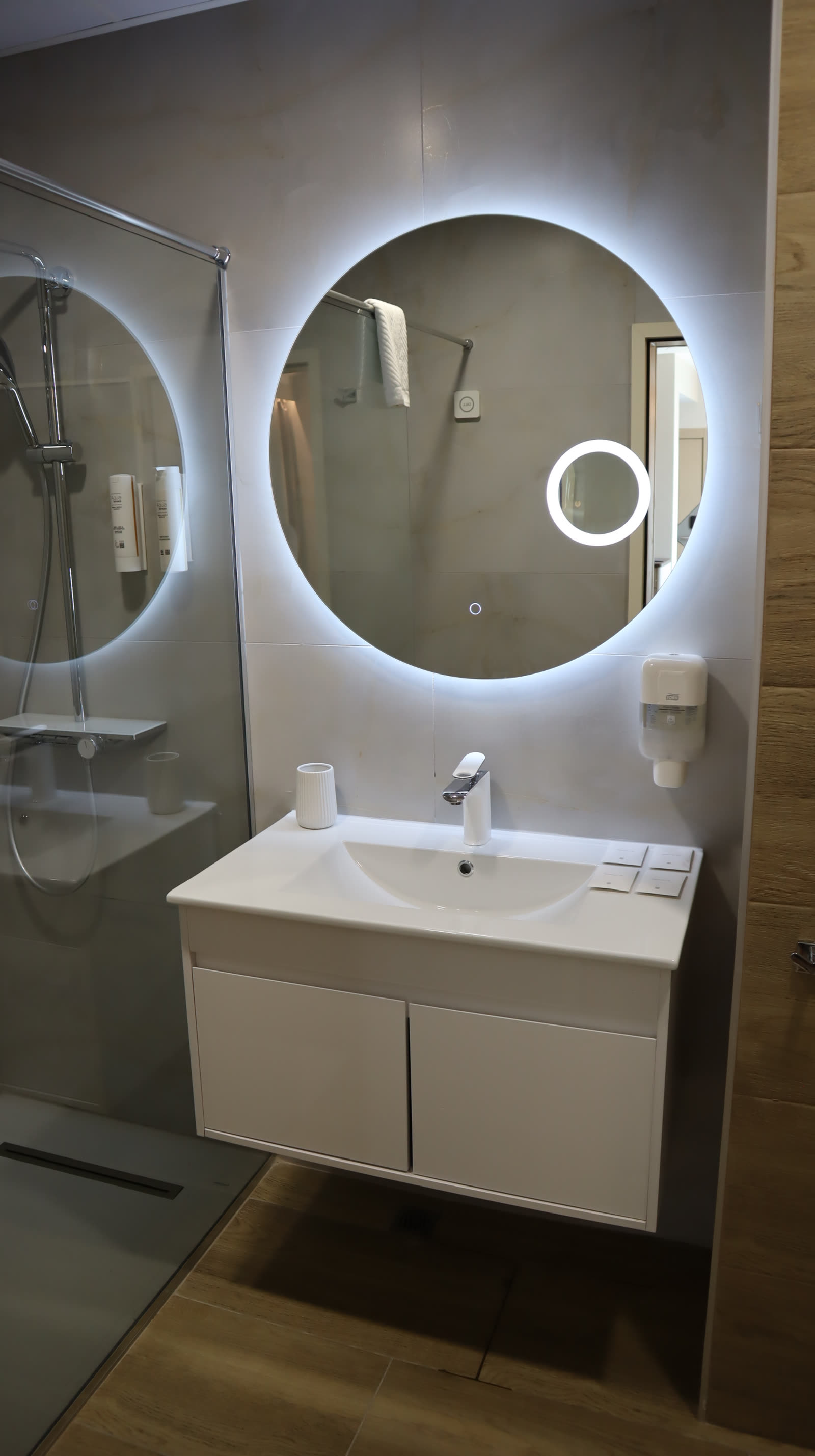 Bathroom with walk-in shower and LED mirror